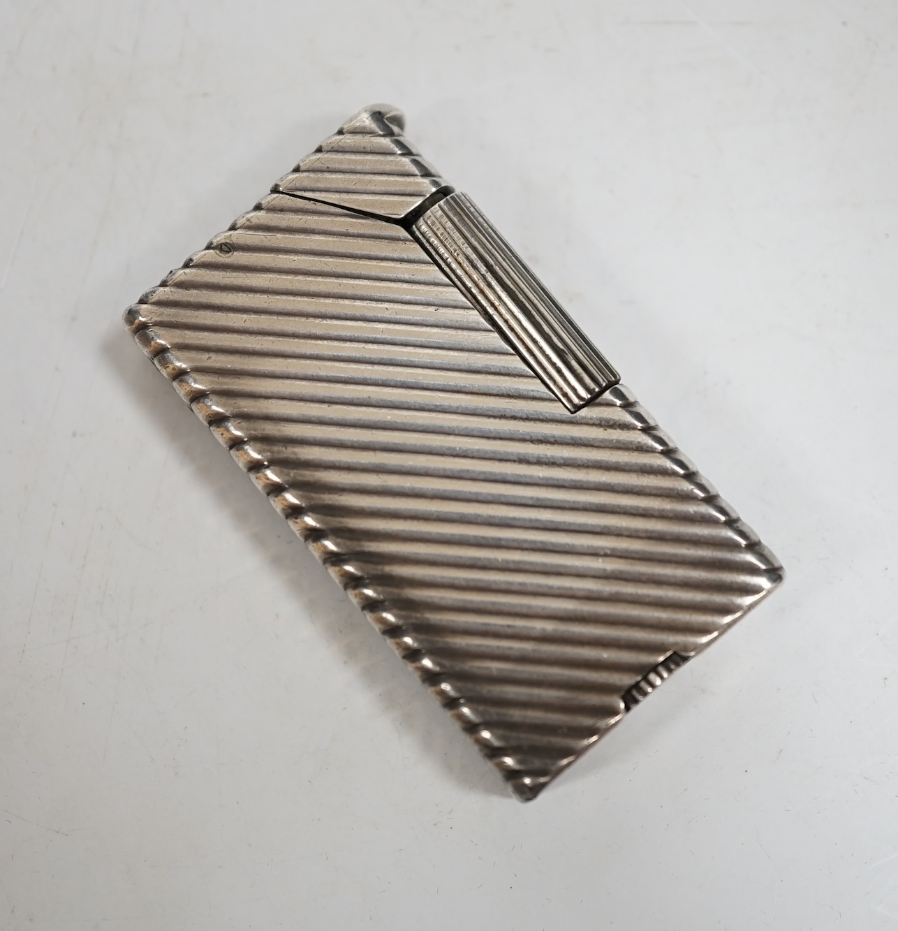 A Dunhill Rollagas lighter, 5.5cm high. Condition - fair, not working
